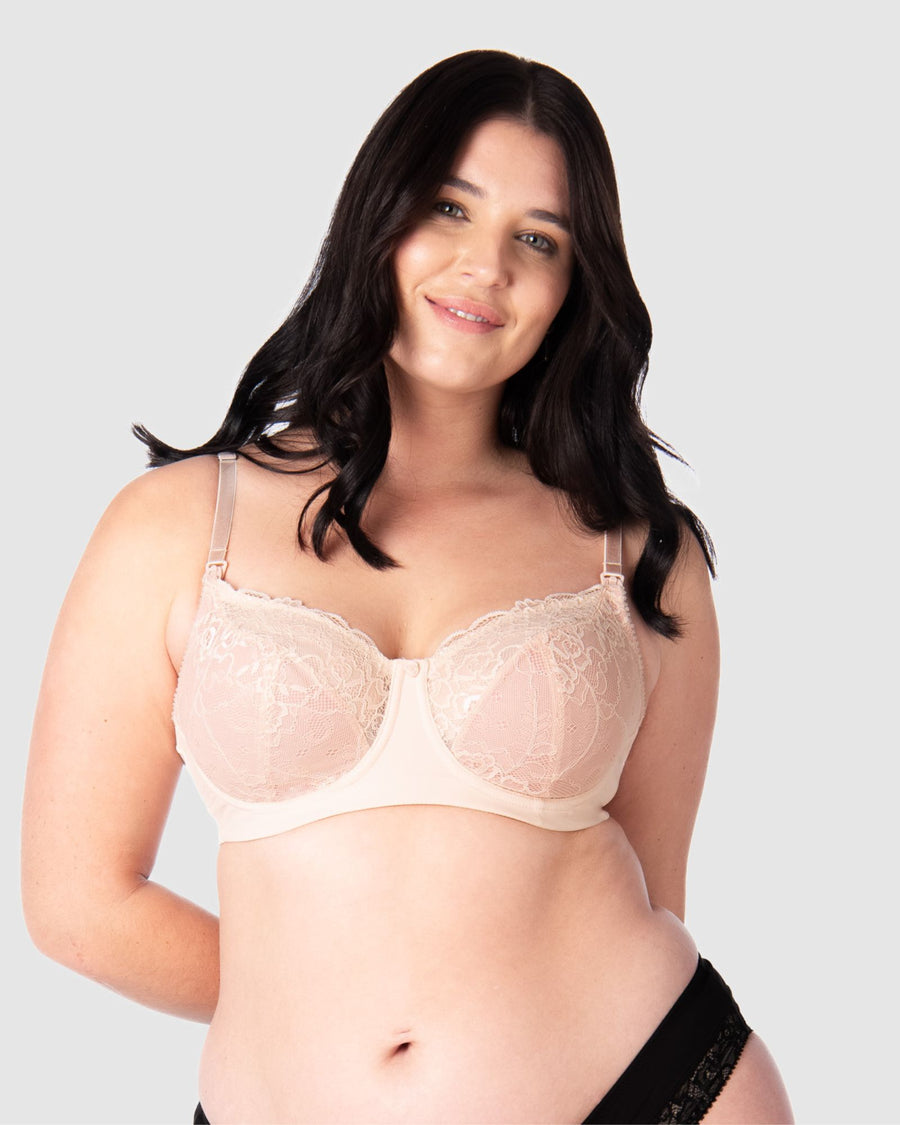Experience complete support with Hotmilk Lingerie AU's Temptation in Powder. This acclaimed award-winning style boasts flexi underwire, a hint of sheer lace over soft cotton cups, convenient nursing clips, and elevated all-day comfort and support. Olivia confidently wears size 14/36D in this essential nursing and maternity bra