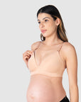 Close-up of Kami, pregnant mother of two, demonstrating the functionality of the HOTMILK AU nursing and maternity bra named AMBITION T-SHIRT WIREFREE in maple, featuring the convenient magnetic nursing clip