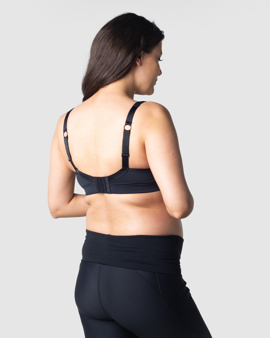 Julia, a mother of one, showcases the ease of Hotmilk Lingerie's Balance Sports Crop Bra nursing traditional brack, alternatively, it can be worn racerback style. Expertly designed for mothers on the go, this bra is perfect for light exercise, yoga, and pilates during both pregnancy and nursing. Elevate your active lifestyle with the seamless combination of functionality and style provided by Hotmilk Lingerie's Balance Sports Crop Bra
