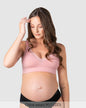 Pregnant woman wearing a hotmilk caress nursing bra by hotmilk