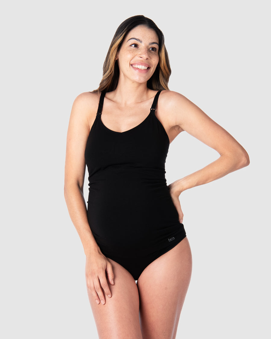 Hotmilk Lingerie's favouriote Camisole, the My Necessity in Black. Kami, an expectant mother of 2, showcases its form-fitting style over her baby bump. Revel in soft, comfortable support for both maternity and postpartum phases, featuring convenient nursing clips for effortless breastfeeding