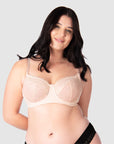 Experience complete support with Hotmilk Lingerie AU's Temptation in Powder. This acclaimed award-winning style boasts flexi underwire, a hint of sheer lace over soft cotton cups, convenient nursing clips, and elevated all-day comfort and support. Olivia confidently wears size 14/36D in this essential nursing and maternity bra
