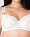 Experience the elegance of Hotmilk Lingerie's True Luxe maternity and nursing bra up close. Revel in the romance and sophistication that define Hotmilk's signature style, featuring semi-sheer crisp white floral lace, intricate twin strap detailing, and convenient signature magnetic nursing clips. Elevate your breastfeeding journey with this exquisite piece