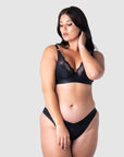 Olivia confidently expresses her personality and style with the coordinated Warrior Plunge Black nursing and breastfeeding bra and briefs in black. Featuring an edgy design, graphic lace, and magnetic clips for added flair, this ensemble is elevated by the supportive features of contour cups and flexi underwire, providing both comfort and lift