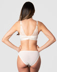 The style of Hotmilk Lingerie's Warrior Plunge Nursing Bra in Ivory extends beyond the captivating graphic lace feature on the back. With 6 rows of eye and hooks, this design accommodates the dynamic changes in a pregnancy and postpartum body, providing flexibility and comfort