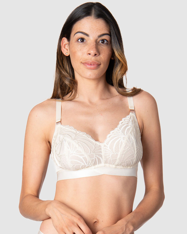Kami, a mother of two, revels in the comfort and versatile style of Hotmilk Lingerie's Warrior Soft Cup. This wire-free maternity and nursing bra offers the ideal blend of lightness and youthfulness, boasting rose gold magnetic nursing clips and sheer graphic lace for a contemporary touch. Experience comfort and style seamlessly combined in this modern maternity essentia