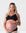Pregnant model wearing the Hotmilk Caress FlexFit Nursing Bra in Black with matching briefs – front view showing wirefree silhouette, lace trim neckline, and supportive fit during pregnancy