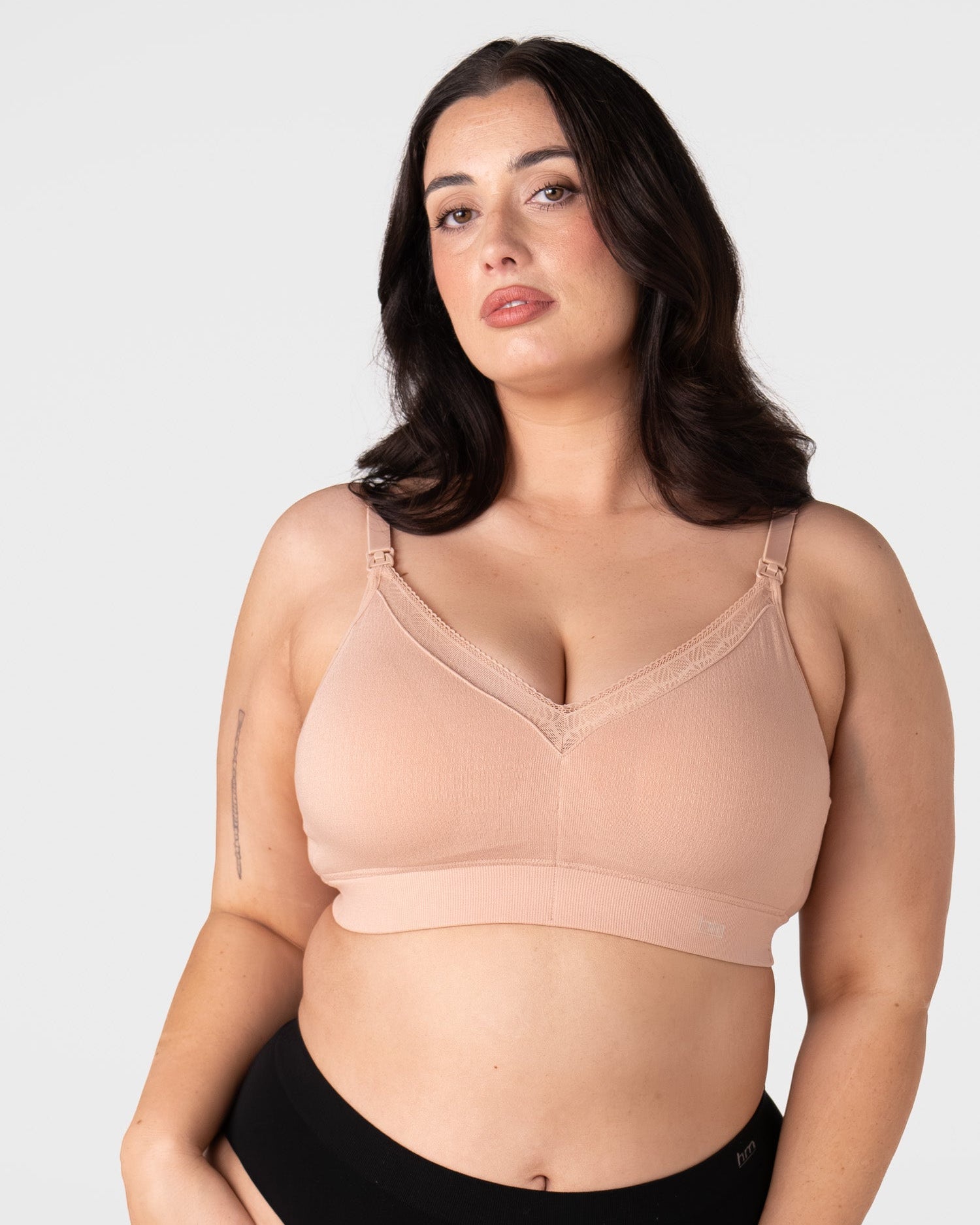 Hotmilk Caress FlexFit Nursing Bra in Cashmere Busty – lifestyle shot, soft bamboo nursing bra designed for fuller cup sizes E to G during pregnancy and breastfeeding