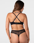 Forever New black maternity t-shirt bra worn in racerback style with crossed-over adjustable straps and wide 6 hook closure