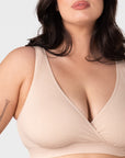 Close-up front view of the Hotmilk My Comfort Nursing Bra in Oat – showing soft ribbed bamboo-blend fabric, wide smoothing straps, and deep plunge wrap neckline