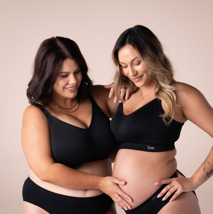 two women wearing black nursing bras