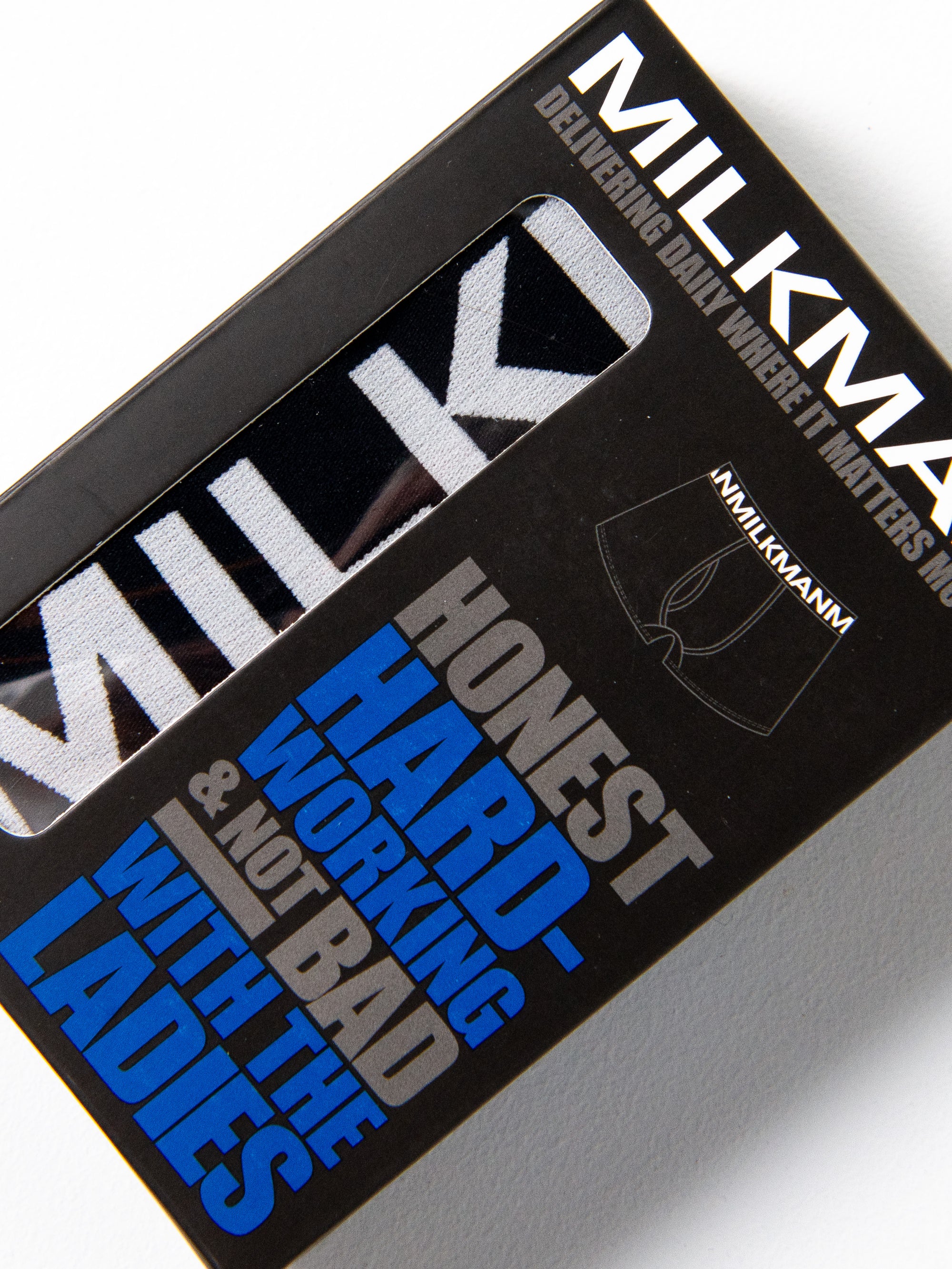 Milkman packaging with text on a white background