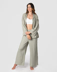 Explore boundless possibilities with Kami, a mother of 2, as she demonstrates Hotmilk Australia's mix-and-match collection by combining the Lounge Top with the Lounge Pant. Crafted from a soft linen blend in a serene Sage color, these pieces offer a comfortable fit and stylish 3/4 length kimono-style sleeves. To complete her perfect loungewear ensemble, Kami adds the My Necessity maternity and breastfeeding bra, ensuring both fashion and functionality in her set