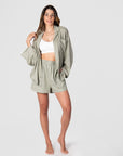 Kami, a mother of 2, shows the way for warm days and nights with Hotmilk's versatile mix-and-match collection. She effortlessly combines the Lounge Top with the Lounge Short, both designed from a soft linen blend in a serene Sage color. These pieces provide a comfortable fit with stylish 3/4 length kimono-style sleeves. To complete her ideal loungewear ensemble, Kami includes the My Necessity maternity and breastfeeding bra, ensuring both fashion and functionality in her set
