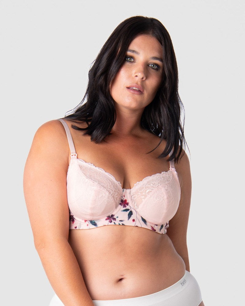 Discover Unparalleled Support and Confidence as Olivia Embraces the New Season Color Release of Hotmilk Lingerie's Award-Winning Temptation Flexiwire Maternity and Nursing Bra. Featuring a Stunning Floral Bloom Print and Soft Blush Lace, this Bra Embodies Feminine Strength for New Mothers. Available Up to a J Cup, it Redefines Comfort and Style, Setting a New Standard for the Best Nursing Bra